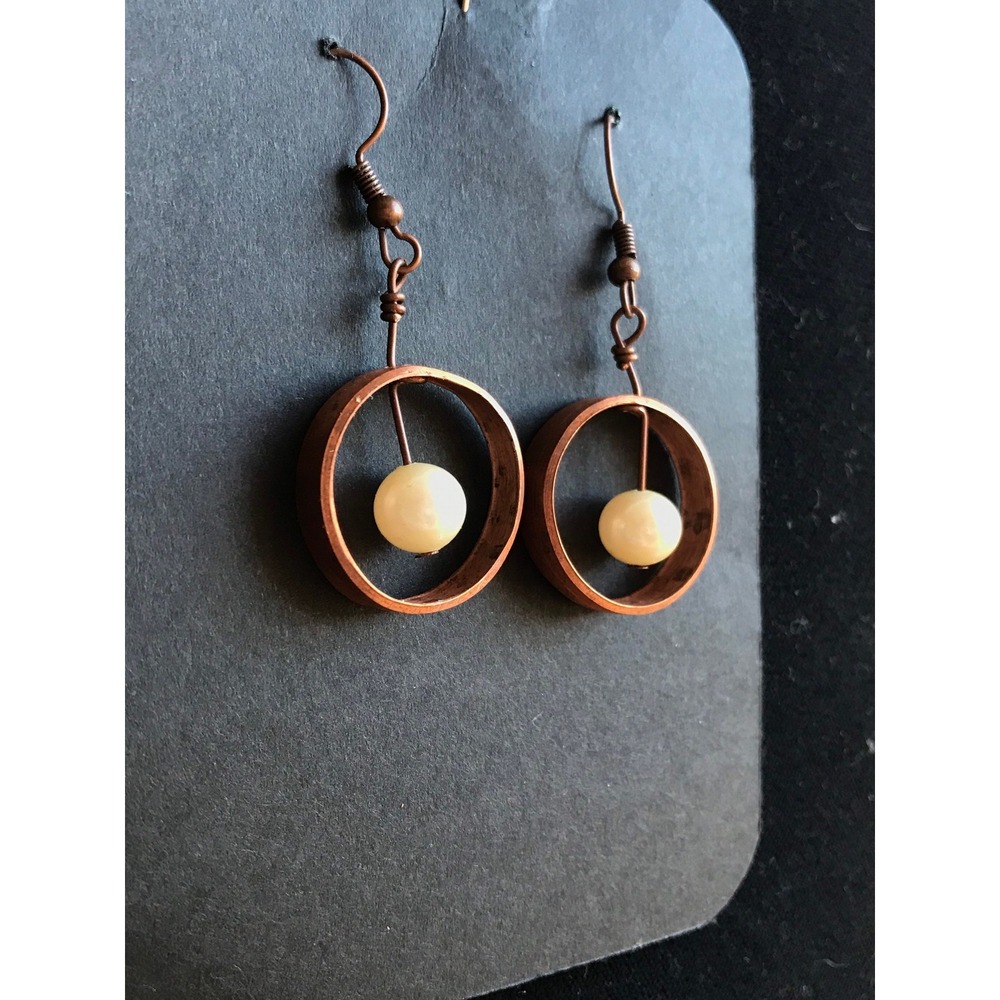 Copper earrings with pearl bead in center 2 inches long